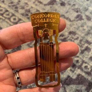 Concordia College gold tone metal 3” bookmark in good used condition